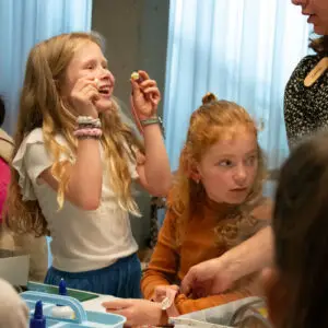 Children crafting with various materials such as beads, leather and fabric on their bracelets seen during a workshop held during the children's festival in the Shoe Quarter